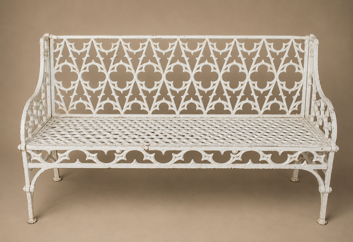 Heavy white gothic style cast iron bench with pierced back and seat