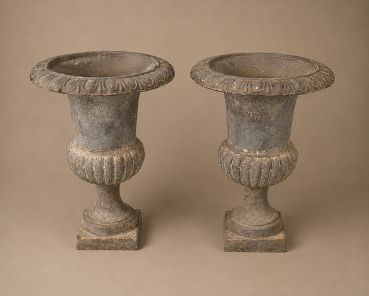 Pair of gray cast iron garden urns- SOLD